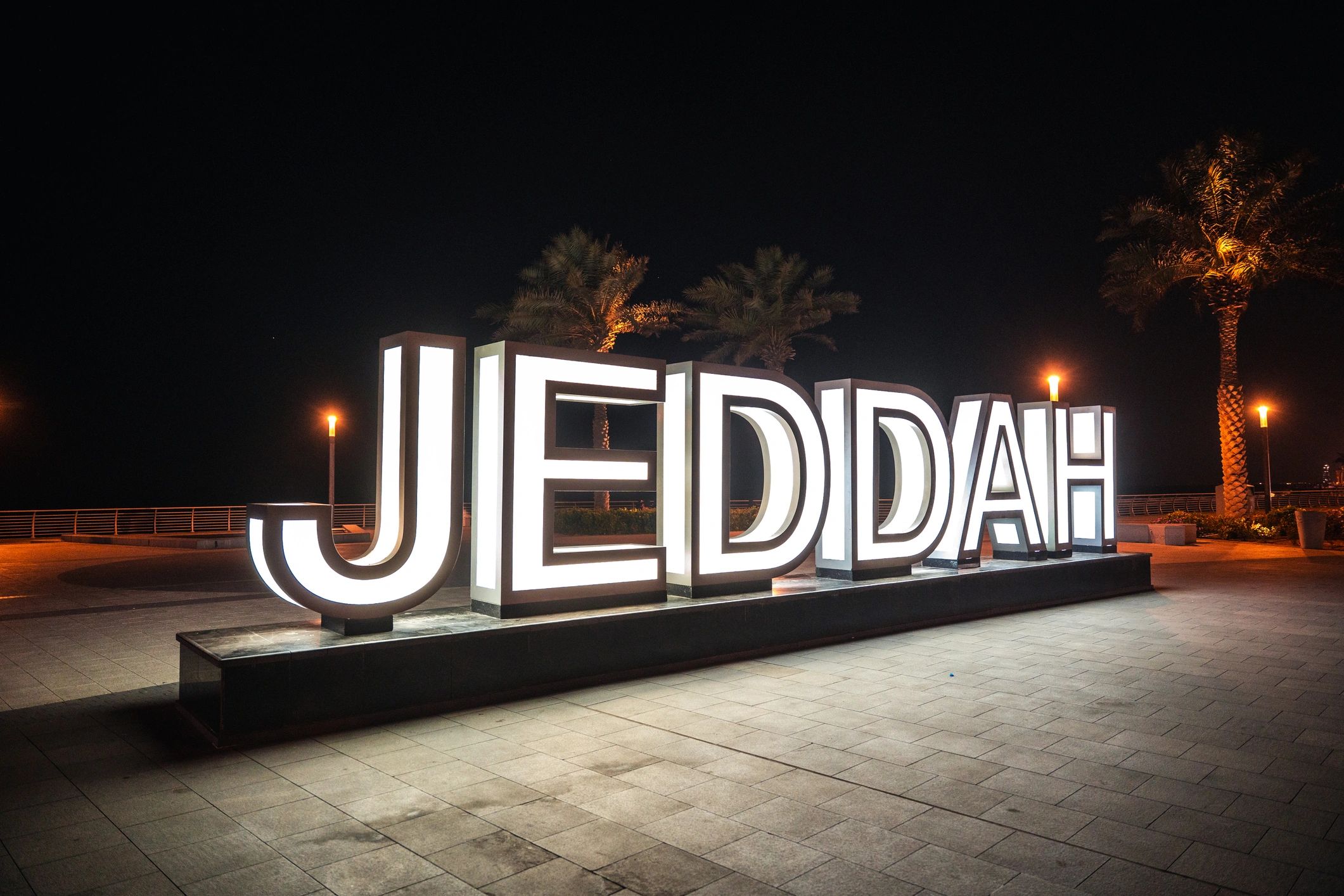 Illuminated commercial sign on facade